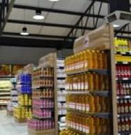 Supermarket shelving stocked with products